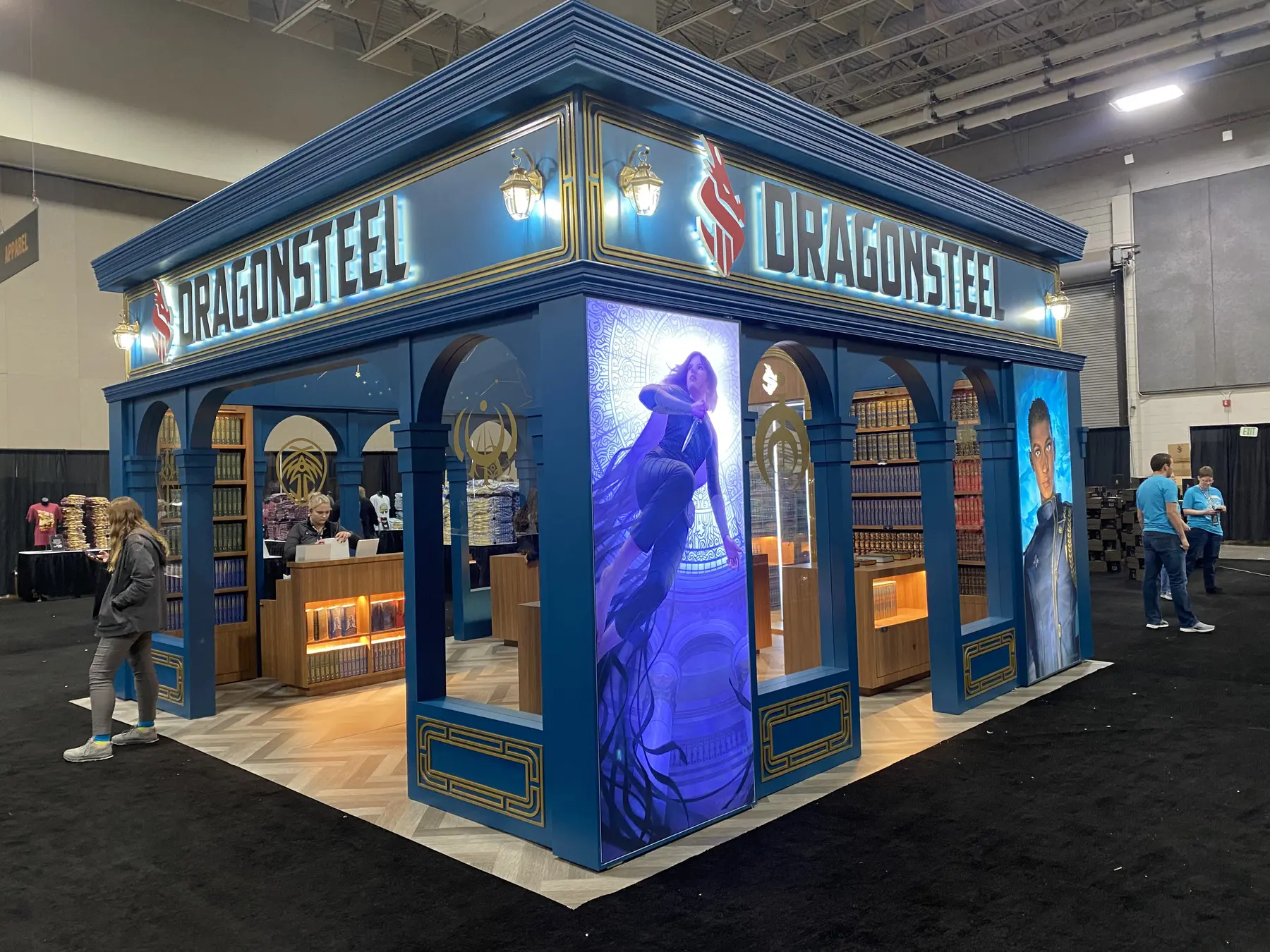 Angled view of the Dragonsteel exhibit showing its overhead branding and side graphic